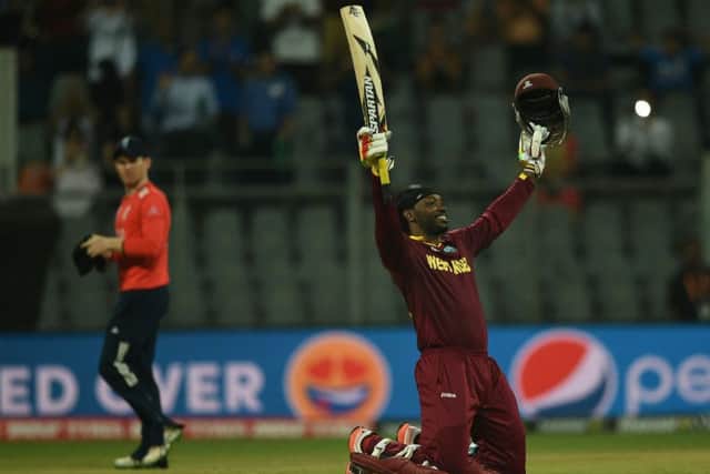 Chris Gayle, top, celebrates West Indies win over England in the group stages. Picture: AFP/Getty