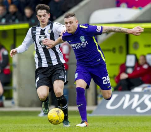 Stuart Carswell and Hibernian's Anthony Stokes. Picture: SNS Group