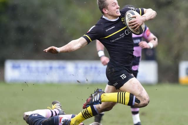Ayrs David Armstrong, left, tackles Tom Galbraith as the home side gave away little.  Picture: Paul Devlin/SNS