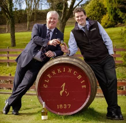 Glenkinchie Distillery manager, Ramsay Borthwick,
and Derek Robertson, CEO of Keep Scotland Beautiful, raise a dram as
they toast Diageos success in environmental excellence
