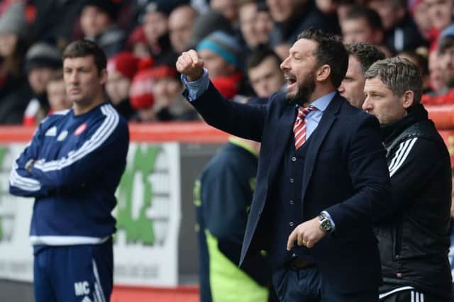 Aberdeen manager Derek McInnes urges his players on during yesterdays 3-0 win over Hamilton. Picture: SNS