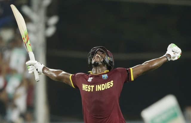 West Indies Carlos Brathwaite celebrates after his fourth successive six secured victory in Kolkata. Picture: AP