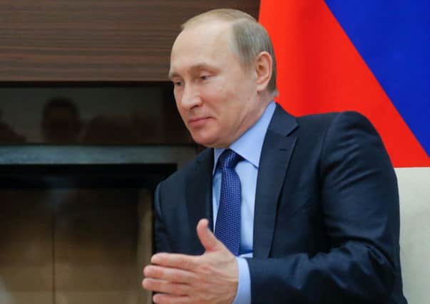 Putin: Associates allegedly involved in money-laundering. Picture: AFP/Getty