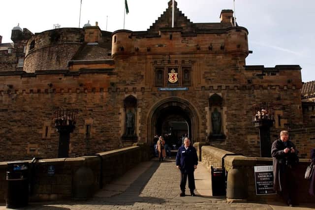 Visitors surround the drawbridge and entrance to Edinburgh Castle.