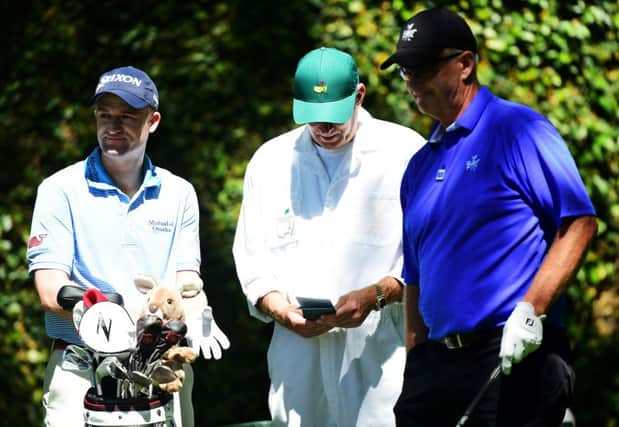 Russell Knox, left, played his first official practice round for the 80th Masters with 1988 winner Sandy Lyle. Picture: Getty Images