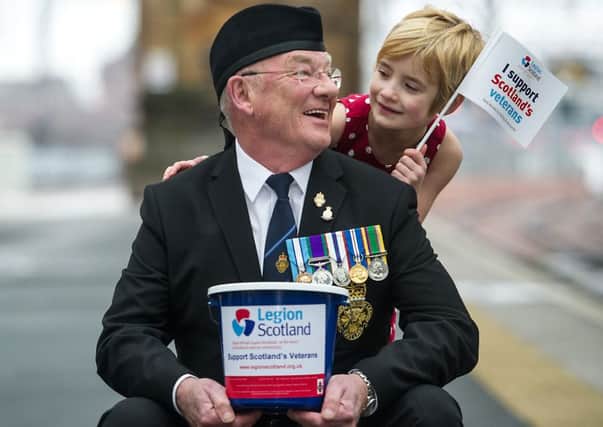 Veteran John Thompson (73), the President of Legion Scotland's Livingston Branch, launched the fundraiser with 6 year-old Lily Murray in Glasgow yesterday. Picture: John Devlin