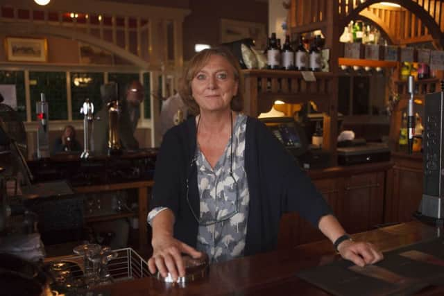 Anne Taylor behind the bar at  The Goth Pub Prestonpans.