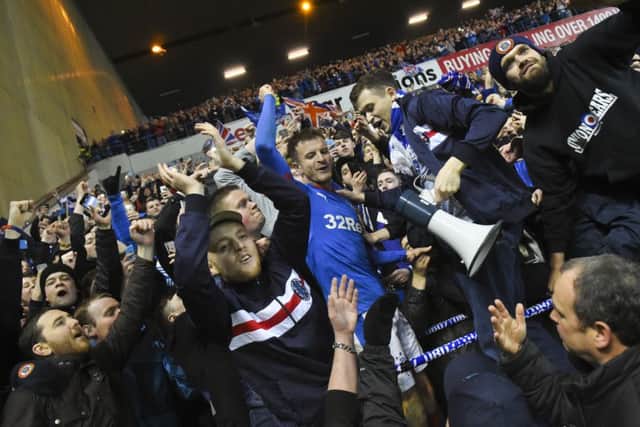 Andy Halliday celebrates with the fans at full time. Picture: SNS