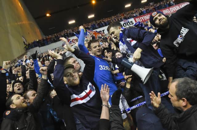 Andy Halliday celebrates with the fans at full time. Picture: SNS