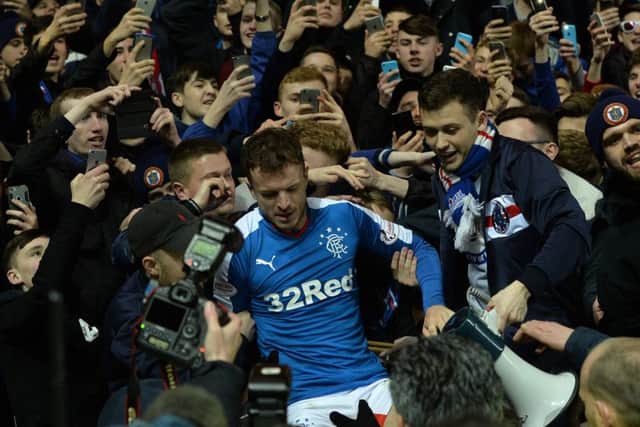 Andy Halliday celebrates with the crowd as Rangers clinch the Scottish Championship title. Picture: Mark Runnacles/Getty Images