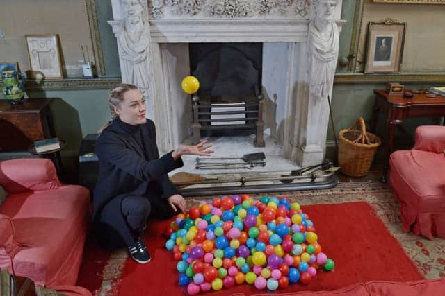 Student Katie Strachan's work gives the illusion that a colourful ball pit has spilled into the formal setting. Picture: Neil Hanna