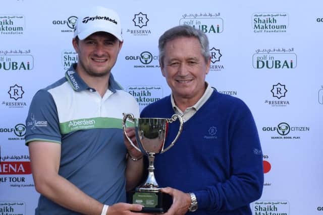 David Law receives the Sotogrande Masters trophy from Manuel Pinero
