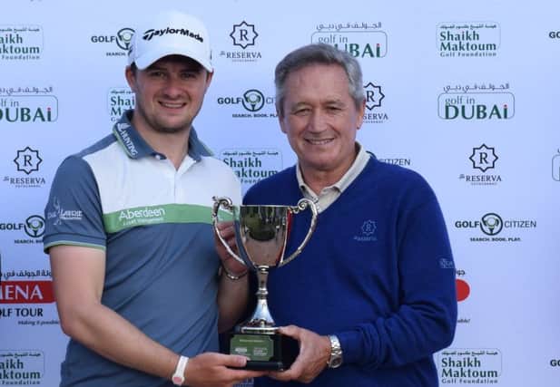 David Law receives the Sotogrande Masters trophy from Manuel Pinero