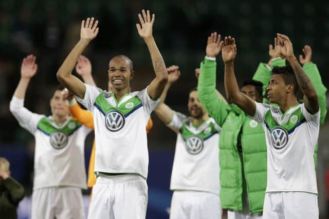 Wolfsburg's Naldo, left, and Luiz Gustavo acknowledge the fans. Picture: AP