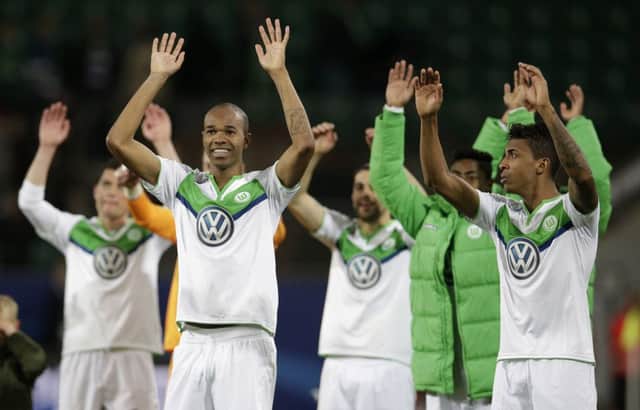 Wolfsburg's Naldo, left, and Luiz Gustavo acknowledge the fans. Picture: AP