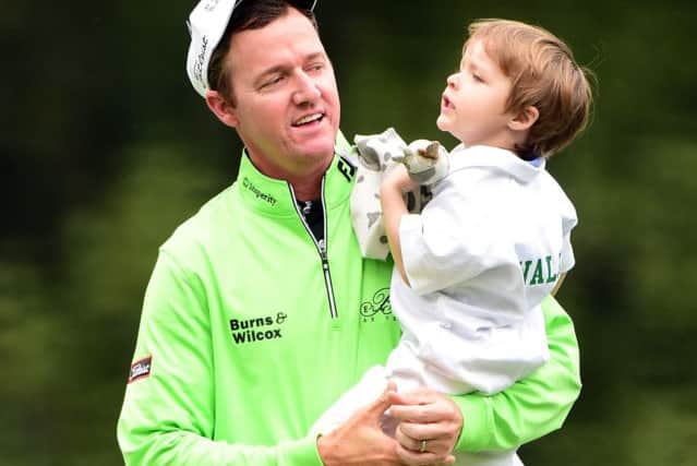 Jimmy Walker celebrates with his son after winning the Par 3 Contest. Picture: Getty Images