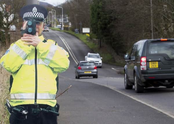 Pop-Up Bob, a life size cut out of a Police officer with speed camera.