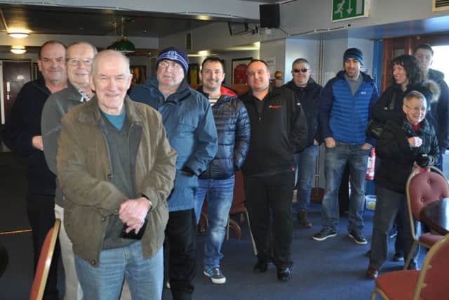 Ed's dad John, fourth from left, joins fans queue for cup final tickets