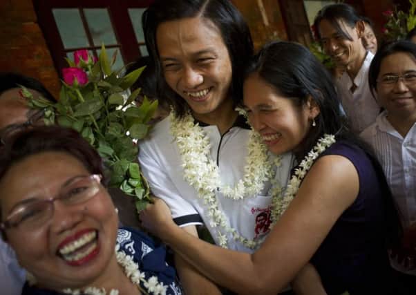 Student protest leader Min Thawe Thit, 33, is welcomed as he arrives at the court yesterday. Picture: AFP/Getty Images
