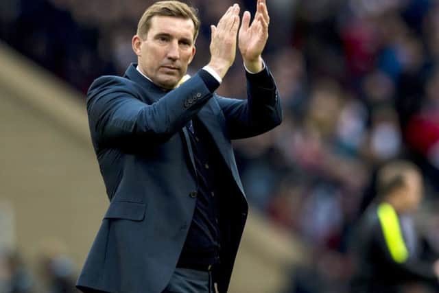 Alan Stubbs applauds his side during their League Cup defeat by Ross County