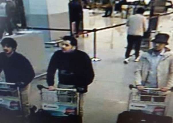 CCTV footage of three men believed to have been involved in the Brussels Airport attacks. Picture: AFP/Belgian Federal Police