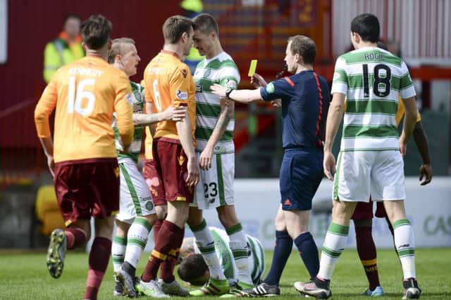 Celtic's Mikael Lustig with Motherwell's Stephen McManus. Picture: SNS
