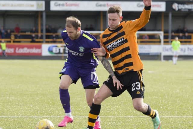 Martin Boyle (left) and Alloa's Mitch Megginson. Picture: SNS Group