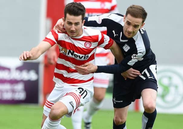 Hamilton's Steven Boyd (left) runs from Dundee's Nick Ross. Picture: SNS Group