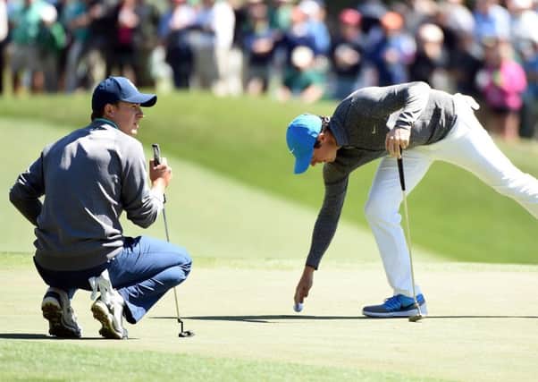Rory McIlroy, right, and Jordan Spieth went head to head on day three of the Masters.  Picture: Harry How/Getty Images