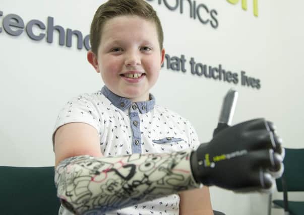 Nine-year-old Josh Cathcart was the first person in the UK to be fitted with Touch Bionics' new bionic hand. Picture: Ian Rutherford