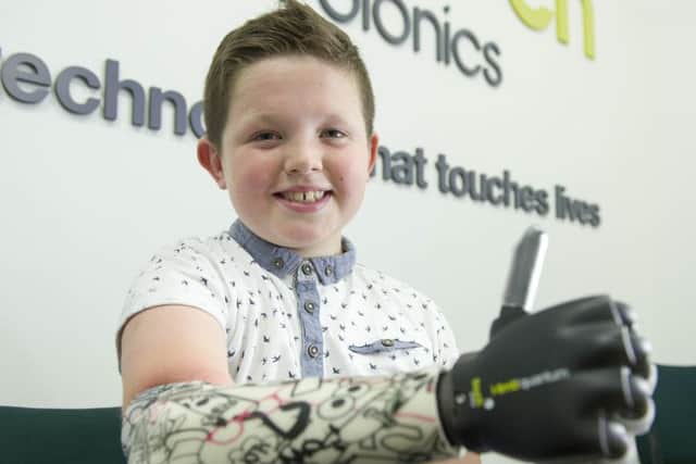 Nine-year-old Josh Cathcart, who was born with his right arm missing from the elbow down is the first person in the UK to be fitted with Touch Bionics' new bionic hand. Josh was at Touch Bionics, Oakbank, Livingston to complete his fitting with the i-limb quantum.  Picture Ian Rutherford