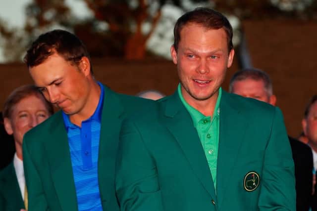 Outgoing champion Jordan Spieth presents Danny Willett with his Green Jacket. Picture: Getty