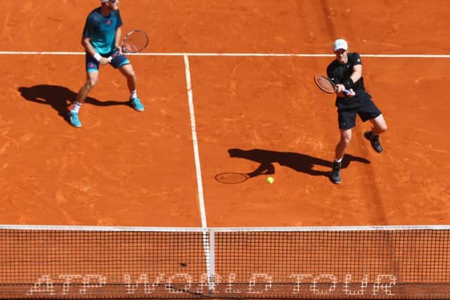 Andy Murray, right, hits a return alongside doubles partner Dom Inglot in their straight sets win against Pablo Cuevas of Uruguay and Marcel Granollers of Spain in Monte Carlo. Picture: Michael Steele/Getty Images