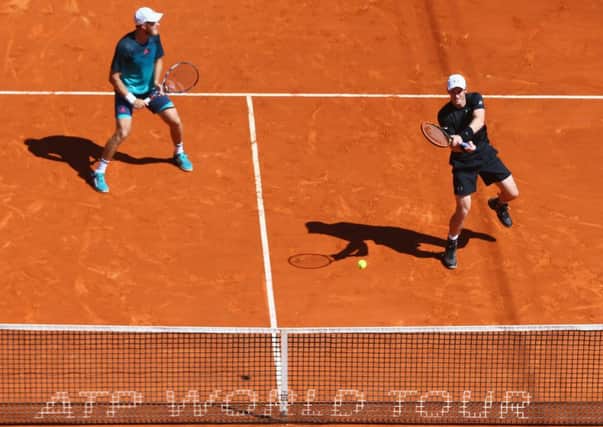 Andy Murray, right, hits a return alongside doubles partner Dom Inglot in their straight sets win against Pablo Cuevas of Uruguay and Marcel Granollers of Spain in Monte Carlo. Picture: Michael Steele/Getty Images