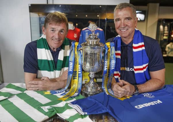 Former Old Firm favourites Kenny Dalglish, left, and Graeme Souness get to grips with one another  in Glasgow yesterday. Picture: Steve Welsh
