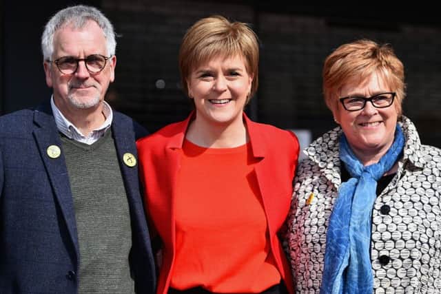 First Minister Nicola Sturgeon with her mother Joan and father Robin campaigning in Irvine. Picture: Getty
