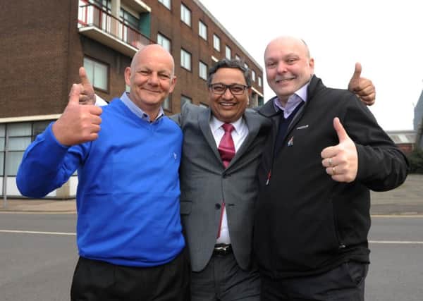 Bimlendra Jha, executive chairman of Longs Steel UK, embraces union officials Paul McBean (L) and Martin Foster. Picture: Hemedia