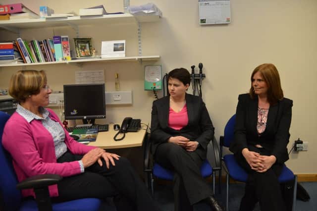 Ruth Davidson at Bonnyrigg Health Centre yesterday with GP Claire Walker and practice manager Sharon Kechida. Picture: Jon Savage