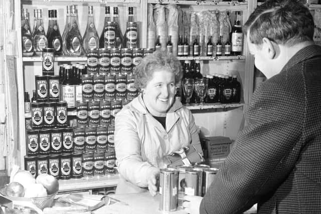 A customer stocks up for Hogmanay- hopefully the beer isn't penny-wabble
