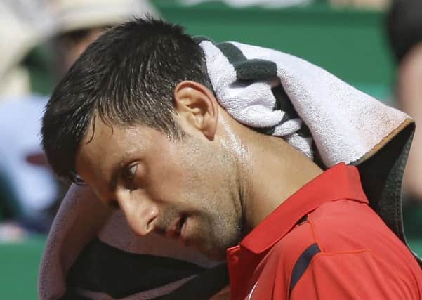 Novak Djokovic finds the going tough during his second-round defeat in Monaco. Picture: AP.