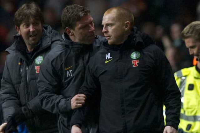 Lennon being led away by assistant Alan Thompson after the incident. Picture: SNS