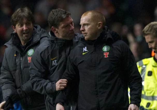 Lennon being led away by assistant Alan Thompson after the incident. Picture: SNS
