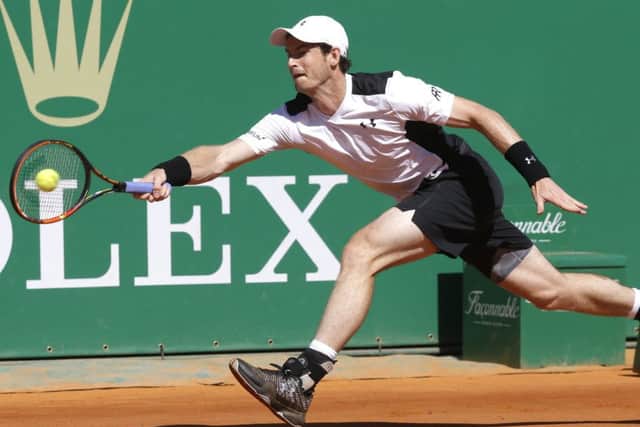 Andy Murray plays a return during the victory over France's Benoit Paire. Picture: Lionel Cironneau/AP