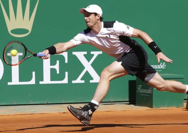 Andy Murray plays a return during the victory over France's Benoit Paire. Picture: Lionel Cironneau/AP