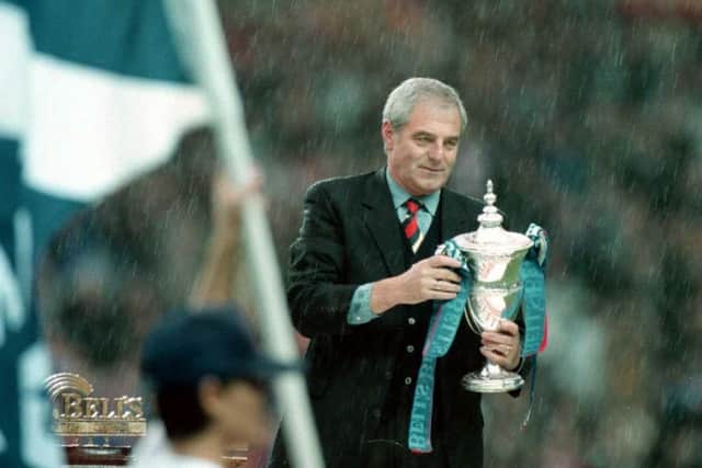 Walter Smith holds the league trophy at Ibrox after leading Rangers to nine-in-a-row in 1997. Picture: SNS