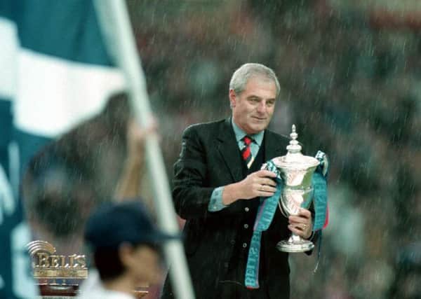 Walter Smith holds the league trophy at Ibrox after leading Rangers to nine-in-a-row in 1997. Picture: SNS