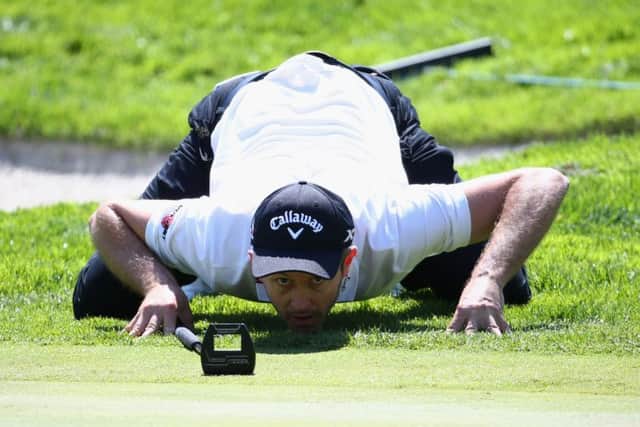 Stuart Manley gets a worms-eye view of his putt on the ninth green at Valderrama. Picture: Getty