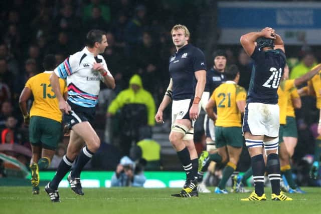 Craig Joubert sprints off the pitch as Richie Gray looks on. Picture: Getty Images