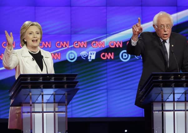 Bernie Sanders and Hillary Clinton speak during the Democratic debate at the Brooklyn Navy Yard in New York. Picture: AP