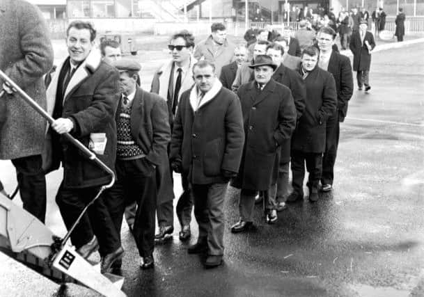 Miners from Midlothian queue to board a flight to London in 1965 to join a protest against pit closures. Picture: TSPL